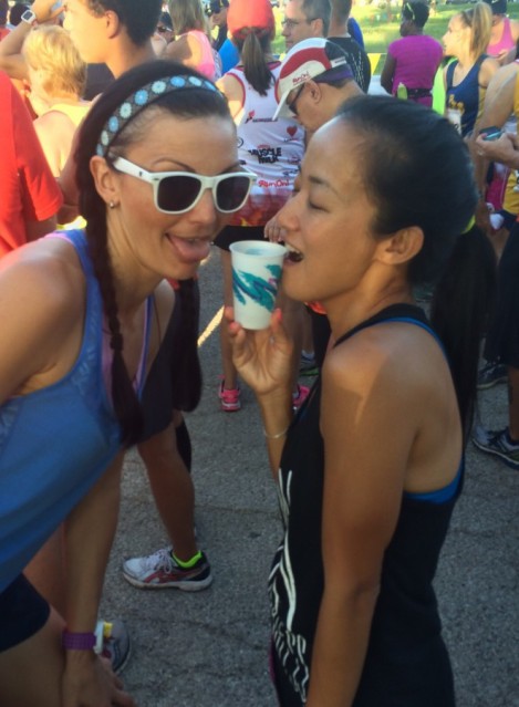 Two Girls, One Cup.      Hydrating before the race.